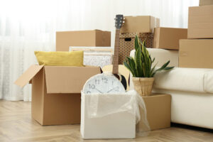 Tips for moving during peak moving season - pre-packing stuff into boxes. 